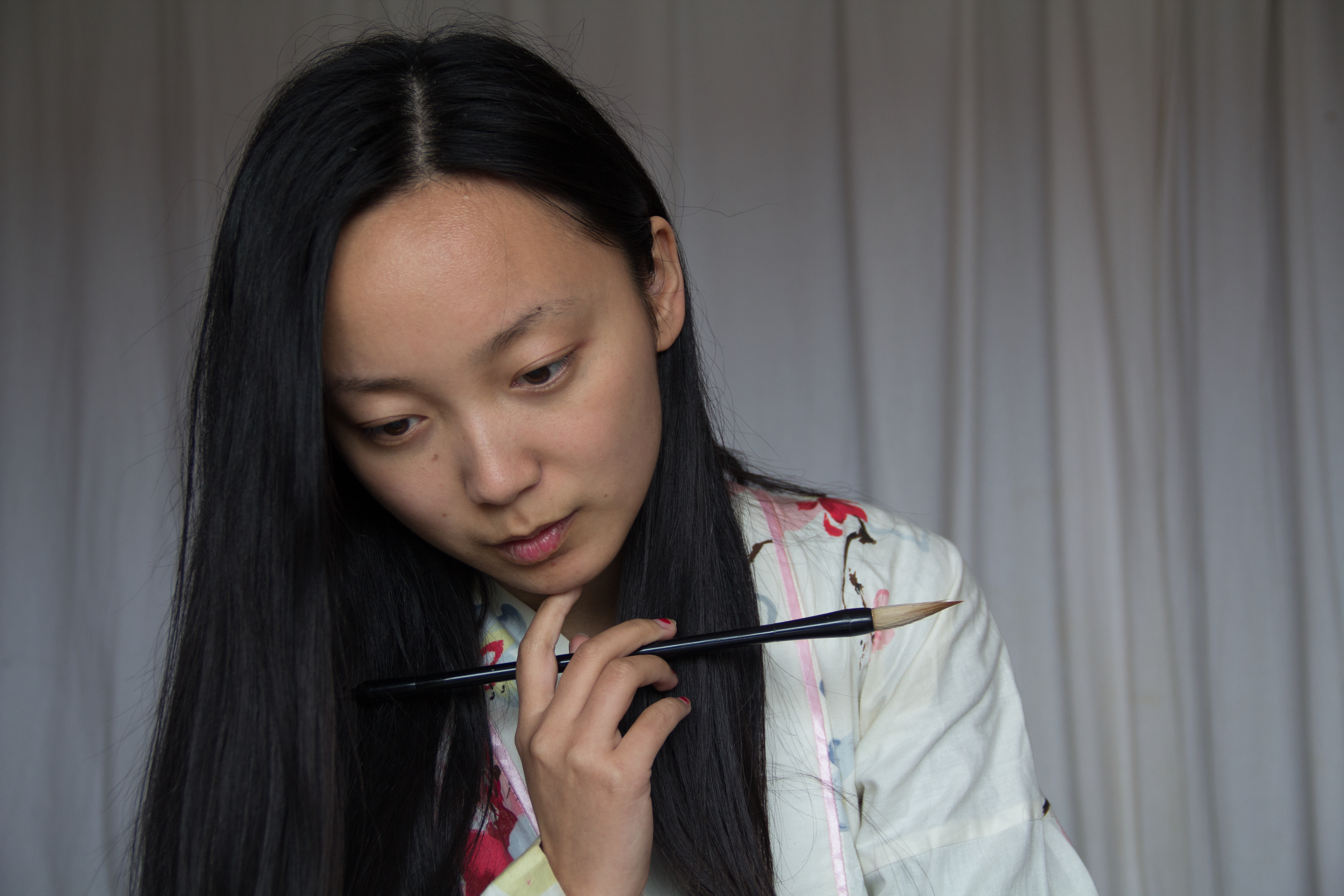 In her leisure time, Kaidi practises calligraphy at home.